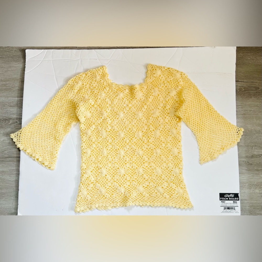 Crochet yellow with bell sleeve.